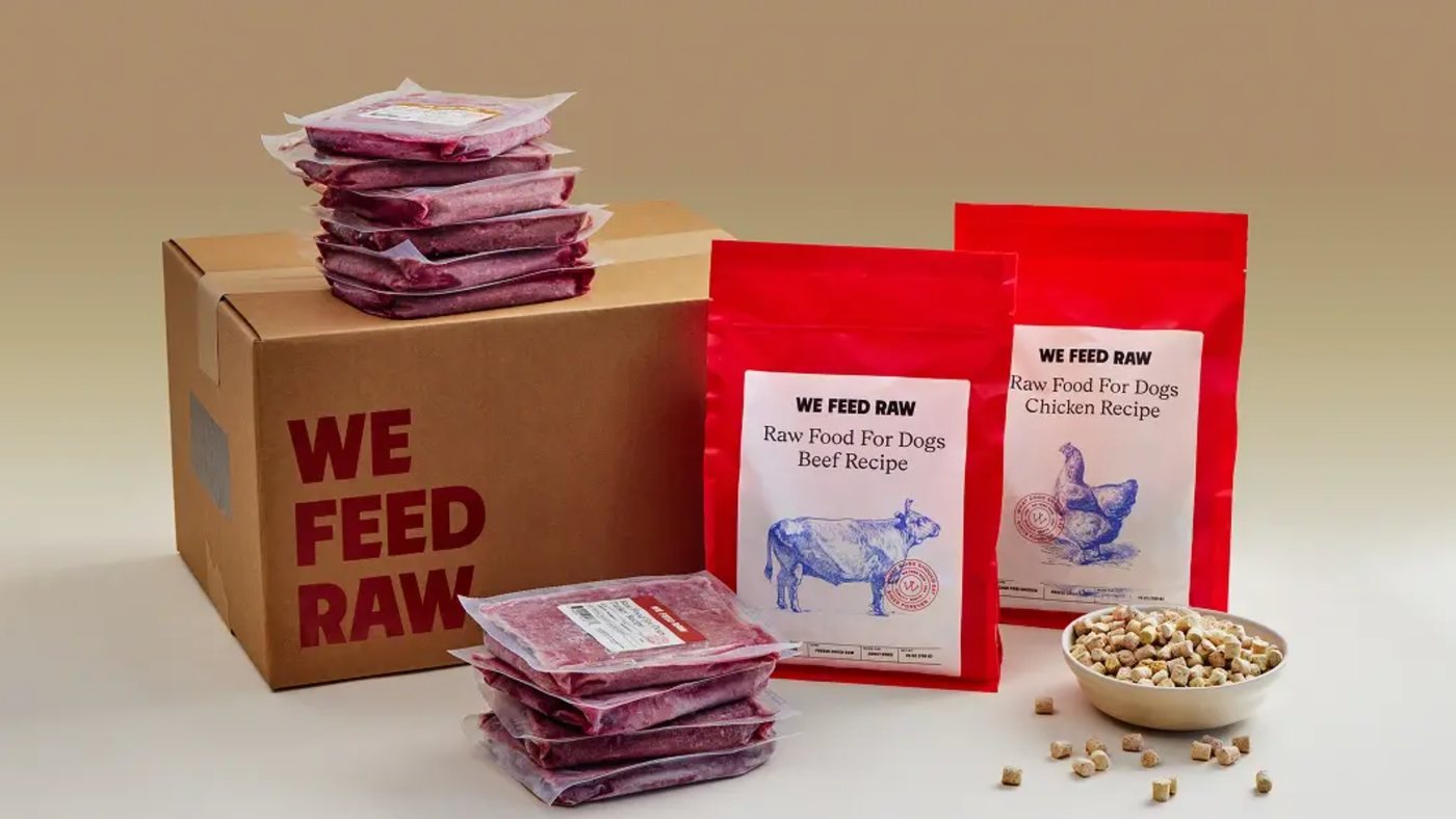 A We Feed Raw delivery box with beef and chicken recipe packs